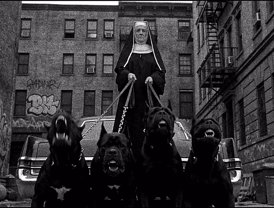 Nun holding four guard dogs in the original DARKMODE film