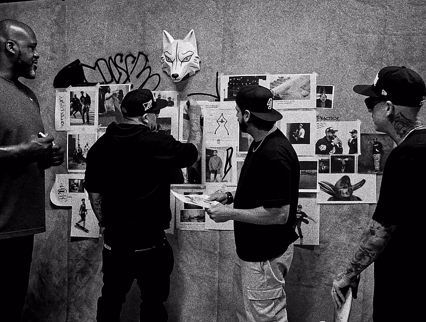 Wide AI scene of the artists sharing the Practice reference-wall setting