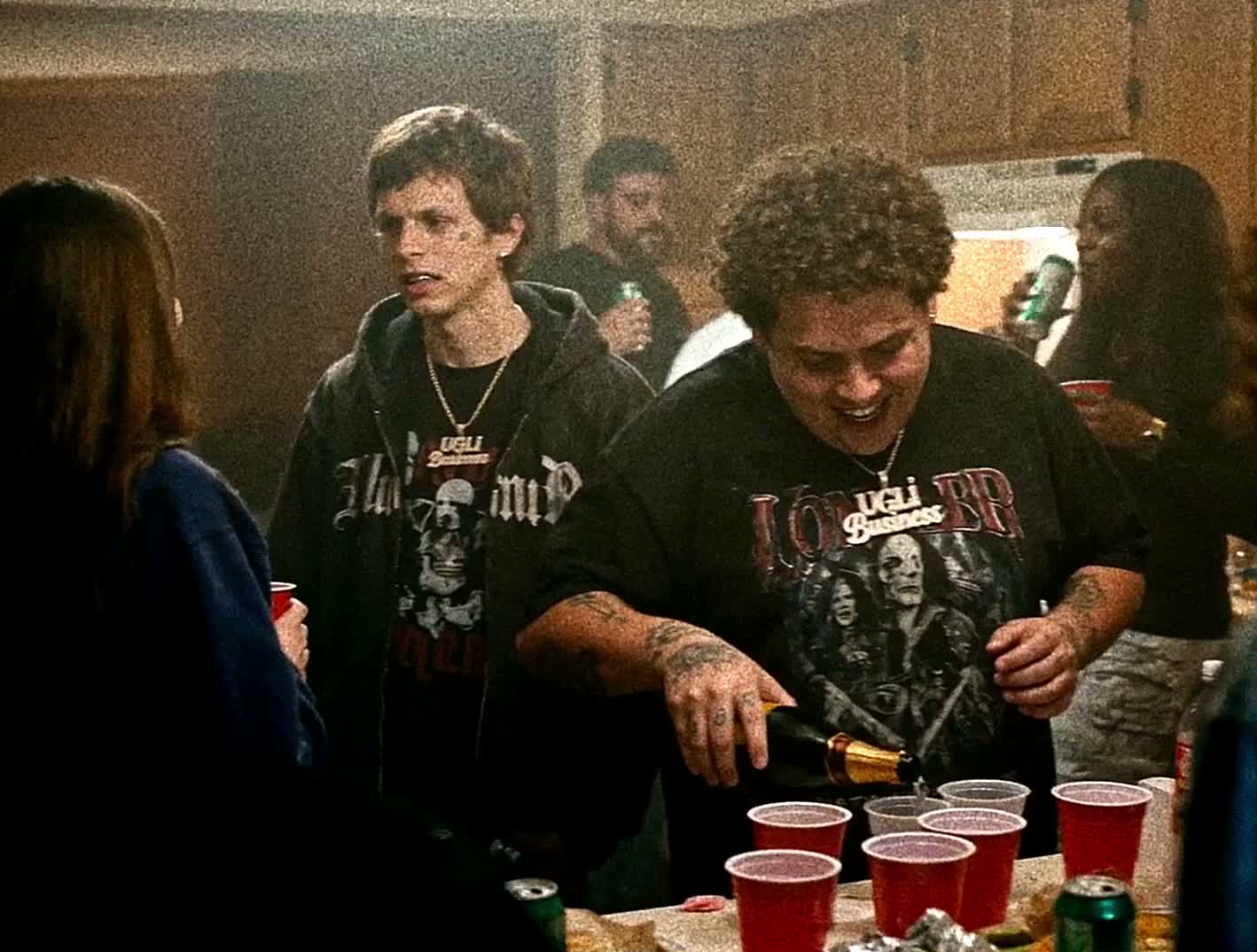 The recurring characters in UGLi Business streetwear at a house party